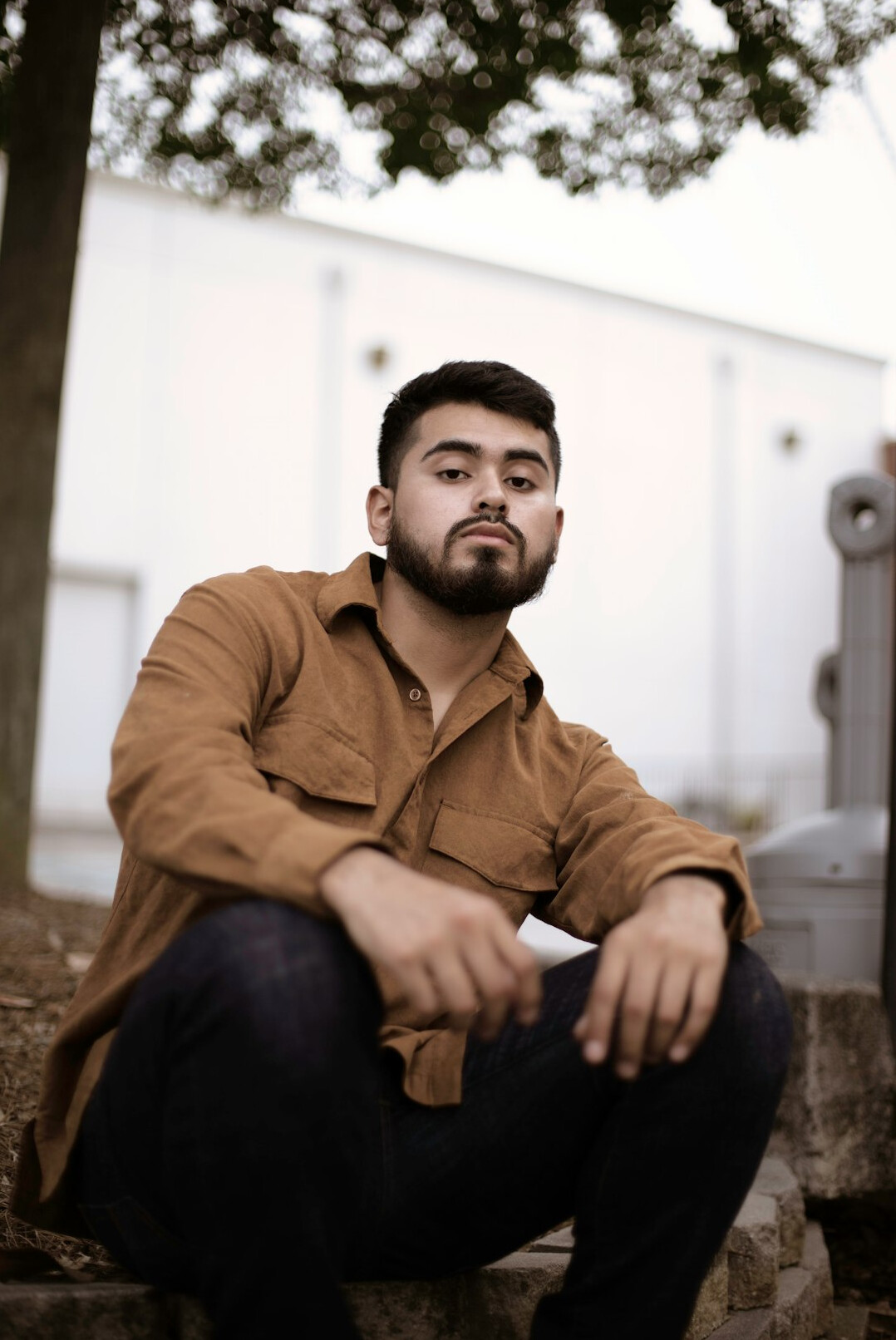 Portrait of a man with short beard in a casual shirt