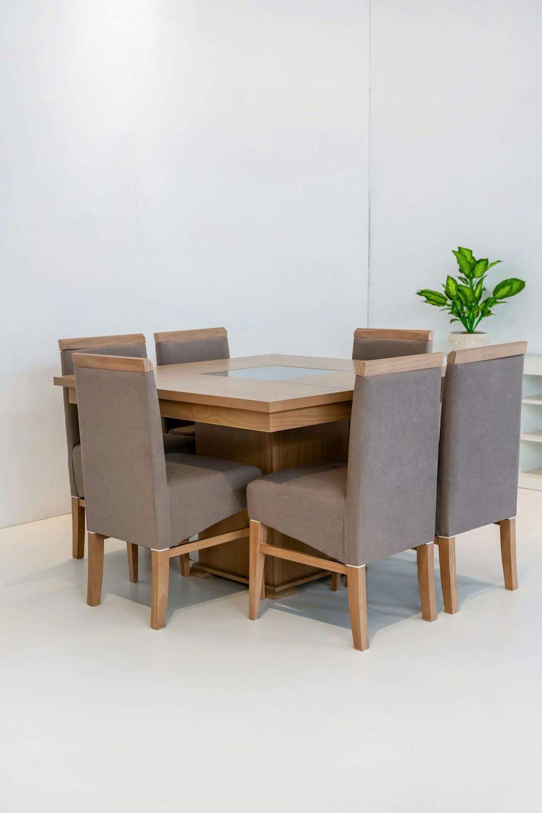 Dining chairs with upholstered seats around a table
