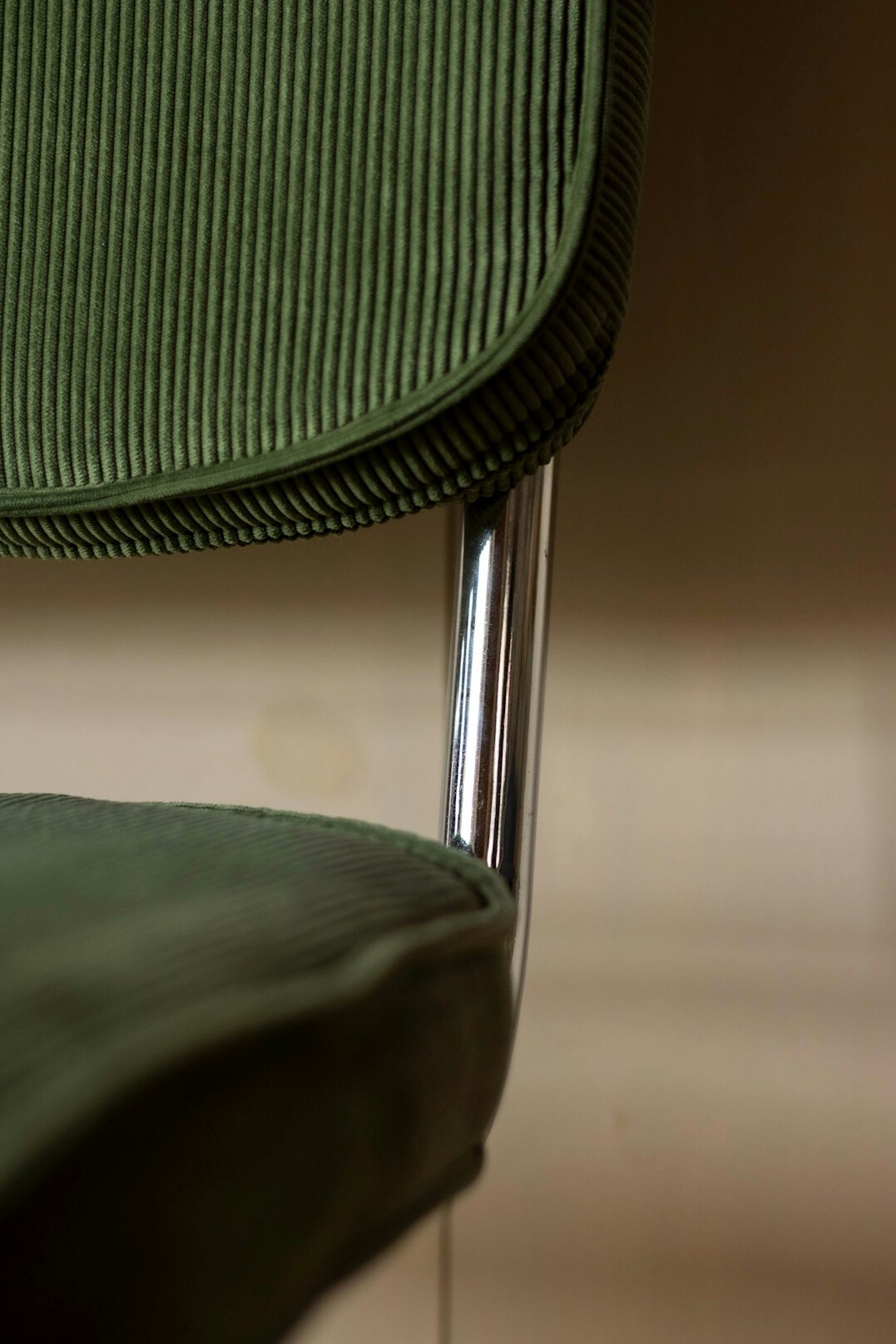 Upholstered chair detail with fabric and stitching