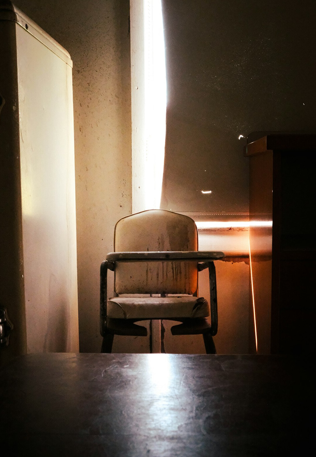 Armchair with new fabric seat in a sunlit room